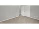 Spacious bedroom with neutral walls, plush carpet, and closet space at 209 Kellerhis Dr, Apex, NC 27502