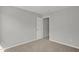 Neutral bedroom featuring cozy carpet and a closet at 209 Kellerhis Dr, Apex, NC 27502