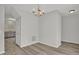 Bright dining room with gray walls, vinyl floors, and a modern chandelier at 209 Kellerhis Dr, Apex, NC 27502