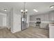 Kitchen with gray cabinets, stainless steel appliances, and vinyl floors at 209 Kellerhis Dr, Apex, NC 27502