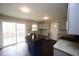 Bright kitchen with updated appliances, granite counters, and access to an outdoor deck area at 221 Lane Of Tristram, Garner, NC 27529