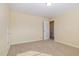 Bedroom with neutral walls, carpet and an open doorway to another room at 225 Beckwith Ave, Clayton, NC 27527