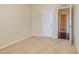 Bedroom with neutral walls, carpet, white trim, and a doorway leading to another room at 225 Beckwith Ave, Clayton, NC 27527