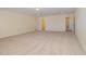 Expansive carpeted bonus room featuring neutral walls and multiple entryways at 225 Beckwith Ave, Clayton, NC 27527
