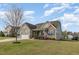Charming two-story home with a mix of siding and stone, complemented by a well-manicured lawn at 225 Beckwith Ave, Clayton, NC 27527