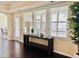 Bright living room with large windows and elegant decor at 225 Beckwith Ave, Clayton, NC 27527