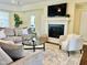 Comfortable living area with a fireplace, plush seating, and stylish decor at 225 Beckwith Ave, Clayton, NC 27527