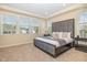 Comfortable main bedroom features a large bed with an upholstered headboard and plenty of natural light at 225 Beckwith Ave, Clayton, NC 27527