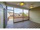 Covered porch with wood floors, ceiling fans, and neighborhood views, perfect for outdoor living at 225 Beckwith Ave, Clayton, NC 27527