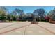 Beautiful grounds surrounding a water fountain in the concrete backyard at 238 N Main St, Wake Forest, NC 27587