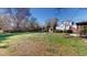 Expansive backyard featuring manicured landscaping, a pergola, and lush green grass at 238 N Main St, Wake Forest, NC 27587