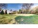Spacious backyard with lush greenery, mature trees, and a charming gazebo at 238 N Main St, Wake Forest, NC 27587