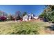 Expansive backyard featuring a lush lawn and beautifully landscaped grounds around the home at 238 N Main St, Wake Forest, NC 27587