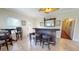 Charming home bar with seating, a ceiling fan, and easy access to other living spaces at 238 N Main St, Wake Forest, NC 27587
