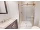 Modern bathroom featuring a tiled shower with glass doors, a vanity, and a toilet at 238 N Main St, Wake Forest, NC 27587