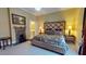 Bedroom features a fireplace, plush carpeting, and refined furniture with en suite access at 238 N Main St, Wake Forest, NC 27587