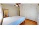 Bright bedroom featuring ample closet space, hardwood floors, and neutral walls at 238 N Main St, Wake Forest, NC 27587