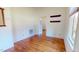 Bright and airy bedroom featuring wood floors and a view of a walk-in closet at 238 N Main St, Wake Forest, NC 27587
