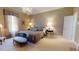 Bedroom features a chandelier, plush carpeting, and refined decorative furniture at 238 N Main St, Wake Forest, NC 27587
