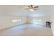 Bright bedroom features plush carpet, ceiling fan, and dormer windows at 238 N Main St, Wake Forest, NC 27587
