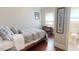 Bedroom featuring wood floors and a desk and chair with access to a bathroom at 238 N Main St, Wake Forest, NC 27587