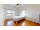 Cozy bedroom with hardwood floors, neutral walls, and two windows for natural light at 238 N Main St, Wake Forest, NC 27587