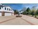 Circular driveway featuring brick accents and central fountain leading to garages at 238 N Main St, Wake Forest, NC 27587