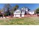 Elegant home with a three-car garage, a brick terrace, and a well-manicured lawn at 238 N Main St, Wake Forest, NC 27587