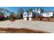 Spacious home with a two-car garage, a water fountain, and a brick-lined driveway at 238 N Main St, Wake Forest, NC 27587