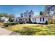 Beautiful two-story house with a well-maintained lawn, complemented by mature trees and meticulous landscaping at 238 N Main St, Wake Forest, NC 27587