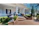 Elegant home with a grand covered porch, featuring classic architectural details and inviting curb appeal at 238 N Main St, Wake Forest, NC 27587