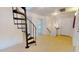 Spacious hallway with an ornamental spiral staircase and an abundance of natural light at 238 N Main St, Wake Forest, NC 27587