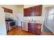 Functional kitchen with stainless steel appliances, granite countertops, and ample cabinet space at 238 N Main St, Wake Forest, NC 27587
