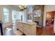 Spacious kitchen island with stone accents, built-in cabinets, and hardwood flooring at 238 N Main St, Wake Forest, NC 27587