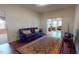 Living room featuring hardwood floors and entry to another living room with tile flooring at 238 N Main St, Wake Forest, NC 27587
