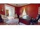 Bright office with large windows, hardwood floors, and antique furnishings at 238 N Main St, Wake Forest, NC 27587
