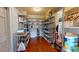 Pantry features hardwood floors, shelving and a small freezer at 238 N Main St, Wake Forest, NC 27587