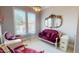 Elegant sitting room with velvet furniture, ornate mirror, and bright natural light at 238 N Main St, Wake Forest, NC 27587
