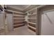 Spacious walk-in closet with built-in shelving for ample storage and organization at 238 N Main St, Wake Forest, NC 27587