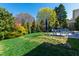 Manicured backyard features a dining table, patio and beautiful landscaping at 2500 Everett Ave, Raleigh, NC 27607