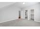 Bright bedroom features neutral carpet and three doors leading to other rooms at 2500 Everett Ave, Raleigh, NC 27607