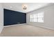 Spacious bedroom features plush carpeting, neutral paint, and a large window for plenty of natural light at 2500 Everett Ave, Raleigh, NC 27607
