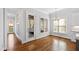 Sunlit breakfast nook features hardwood floors and a view of the screened porch at 2500 Everett Ave, Raleigh, NC 27607