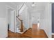 Elegant foyer featuring hardwood floors, a staircase, and access to multiple rooms at 2500 Everett Ave, Raleigh, NC 27607
