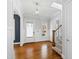 Bright foyer with hardwood floors, staircase, and classic trim at 2500 Everett Ave, Raleigh, NC 27607