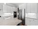 Modern kitchen featuring stainless steel appliances, white cabinets, and granite counters at 2500 Everett Ave, Raleigh, NC 27607