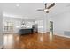 A spacious kitchen with white cabinets, stainless steel appliances, and a dark gray kitchen island at 2500 Everett Ave, Raleigh, NC 27607