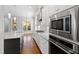 Gourmet kitchen features stainless steel appliances, white cabinets, and granite countertops at 2500 Everett Ave, Raleigh, NC 27607