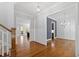 Open-concept living room with hardwood floors, access to dining and adjacent room at 2500 Everett Ave, Raleigh, NC 27607