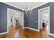Spacious living room featuring hardwood floors, gray walls, and easy access to other rooms at 2500 Everett Ave, Raleigh, NC 27607